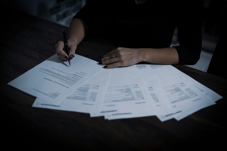 HR professional reviewing an employee personnel file and records